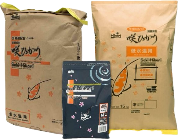 Multiple bags of Saki-Hikari Multi Season wheat-germ koi food with medium or large pellets—premium Hikari koi food for year-round color and growth.