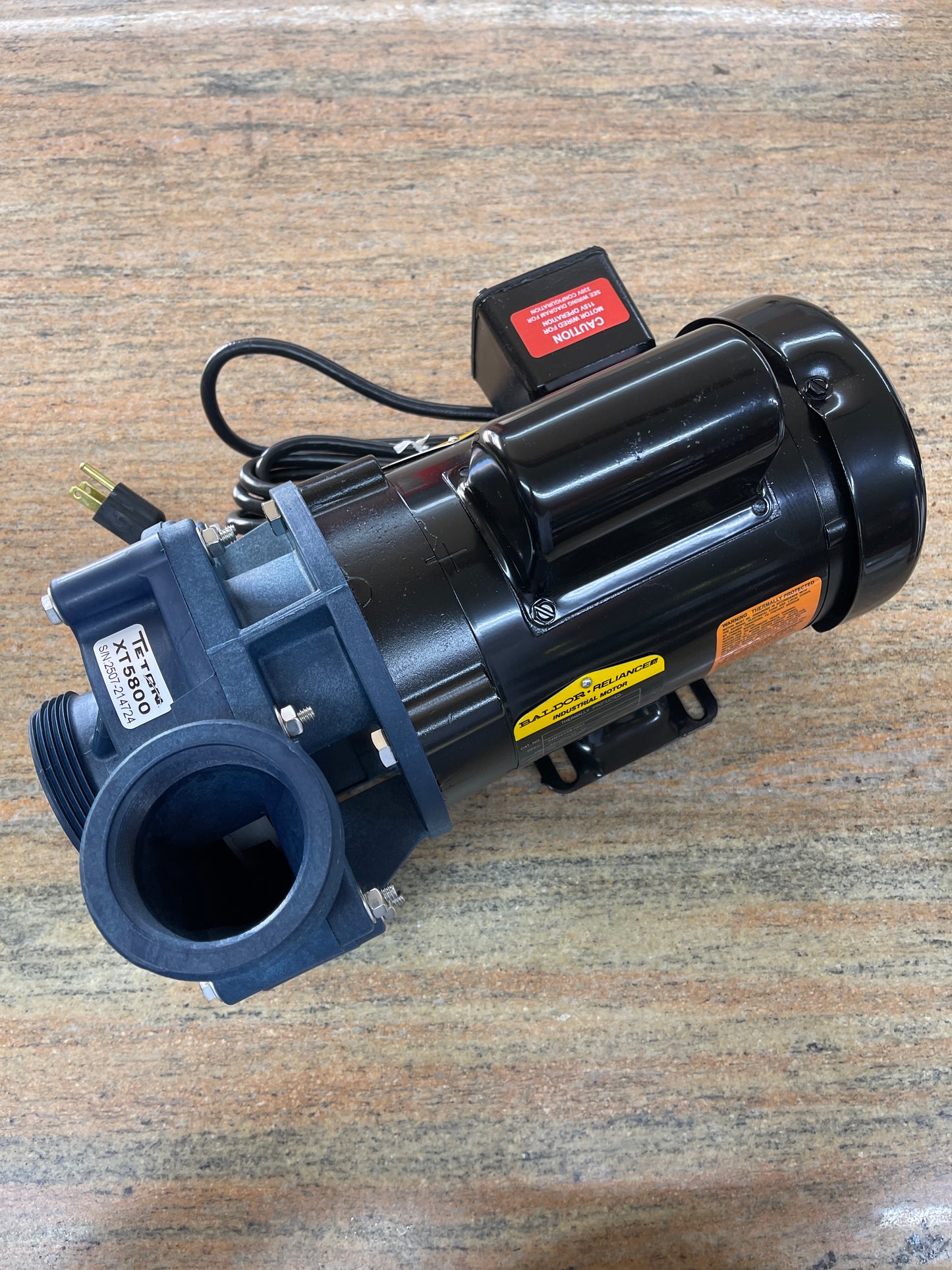 Teton XT Ecostream external pond pump, three-quarter rear view showing the motor housing, wiring box and power cord